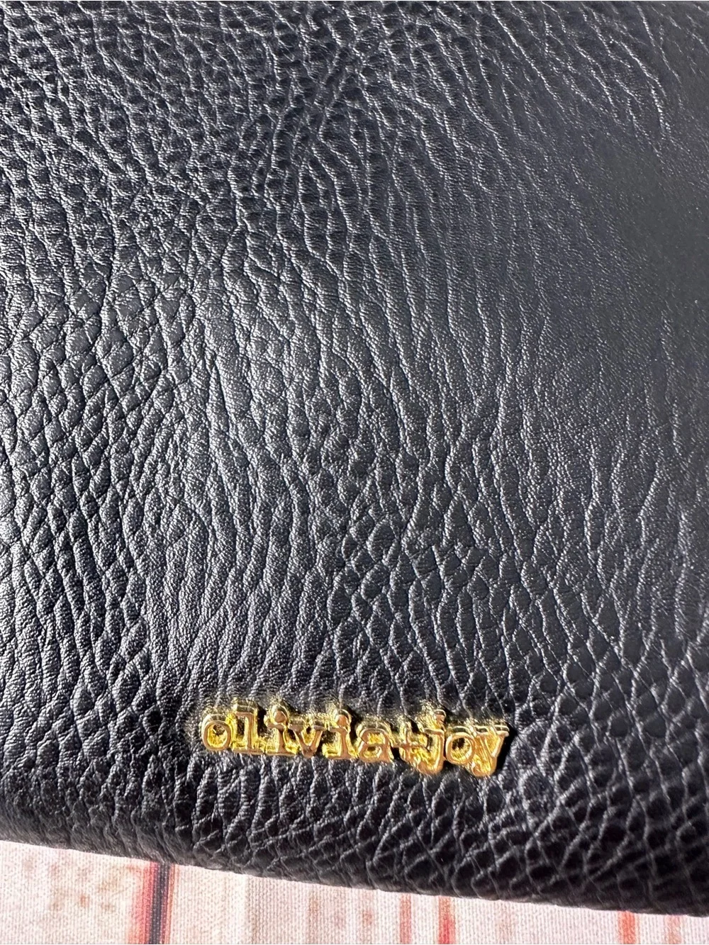 Olivia + Joy Black Pebbled Leather Wristlet Clutch with Gold Logo